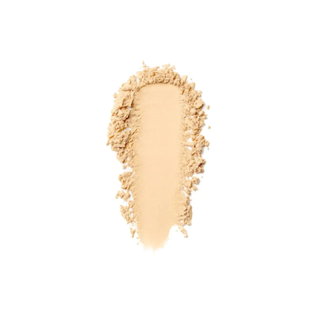 Loose setting powder swatch in a warm tone Six Beauty
