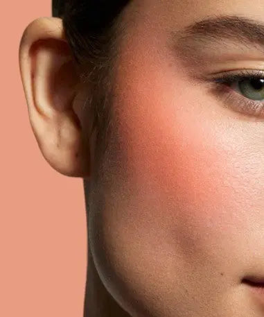 Orange powder blush swatch on white background | SIX BEAUTY